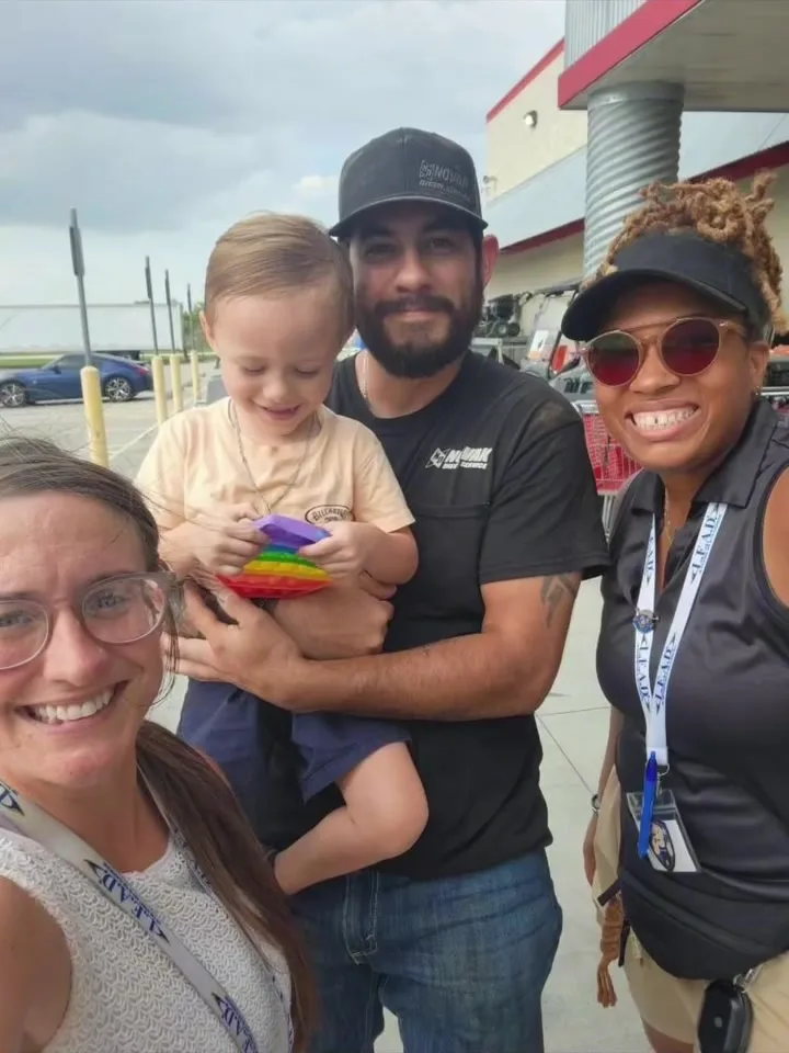 A GA Jersey Village team member connecting with a family at a community event