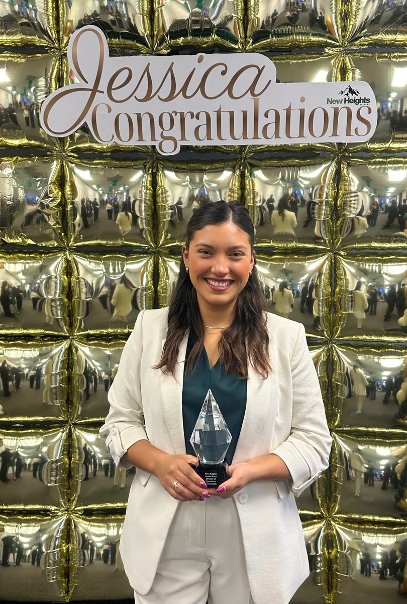 A GA Jersey Village team member celebrating an award
